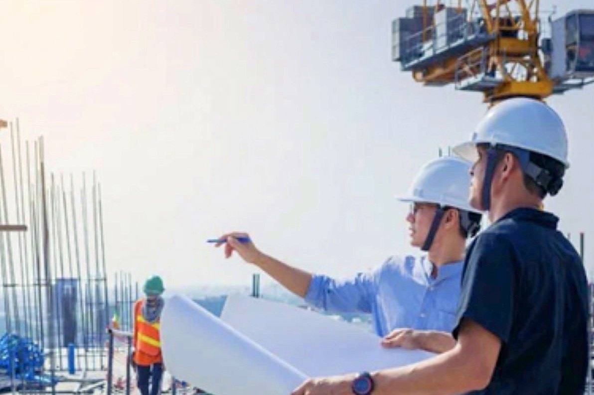 Engineers reviewing plans on a job site